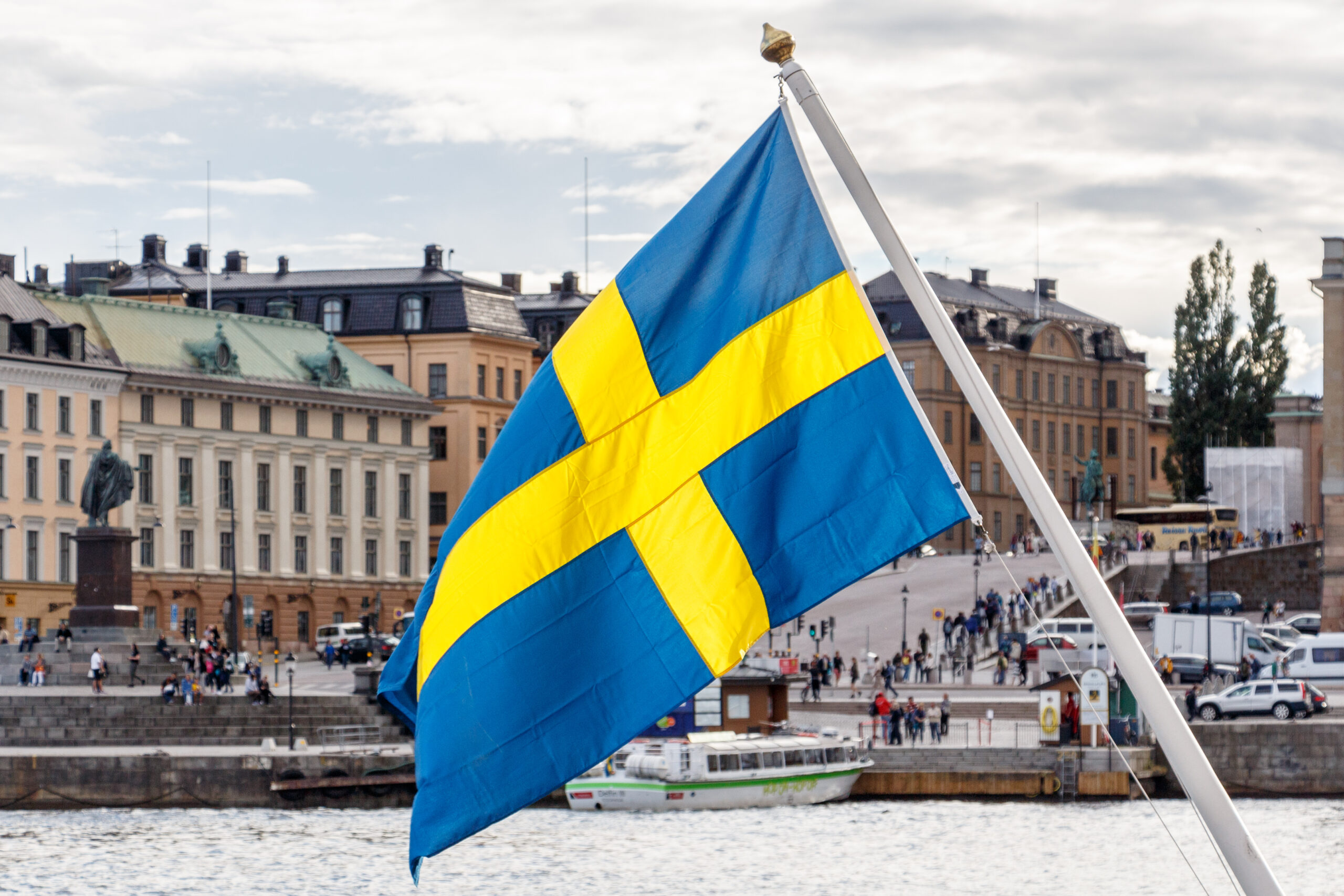 Sweden flag and Stockholm old town Gamla Stan
