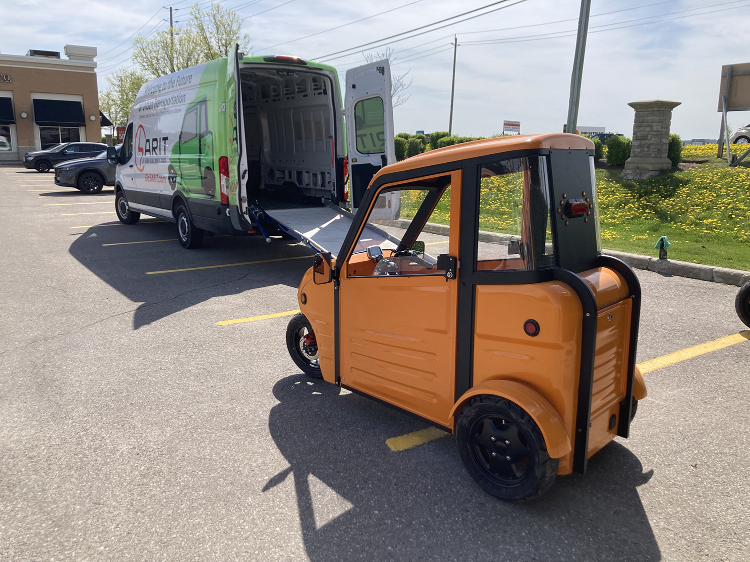 Two Sarit micro EVs can fit into a conventional van for transportation. Neil Vorano / The Charge