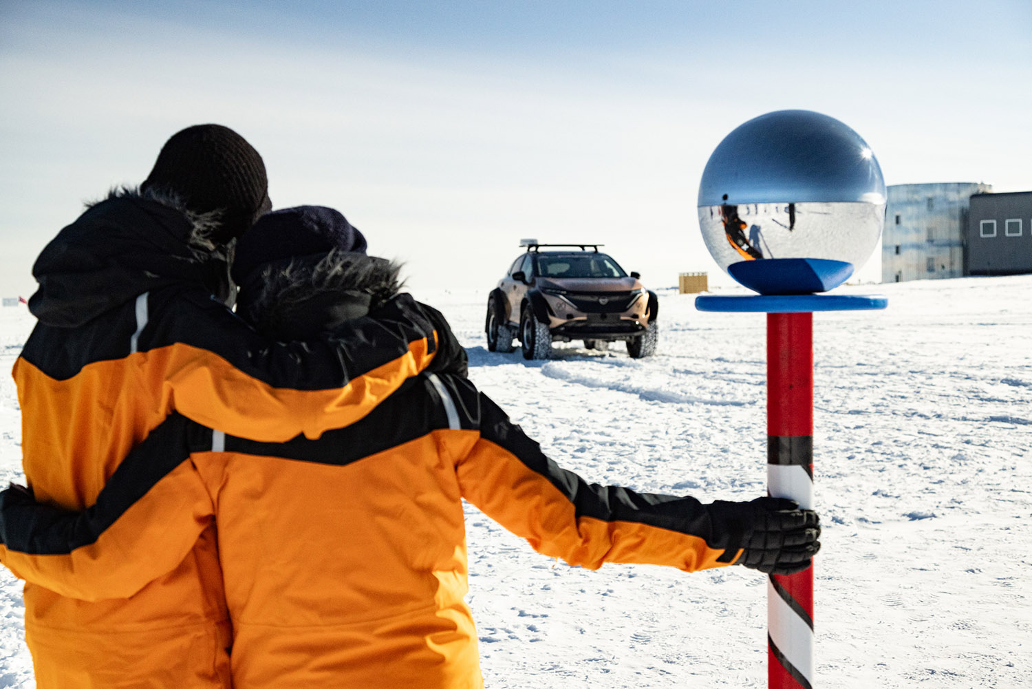 Chris and Julie Ramsey at the South Pole in Antarctica with their Nissan Ariya